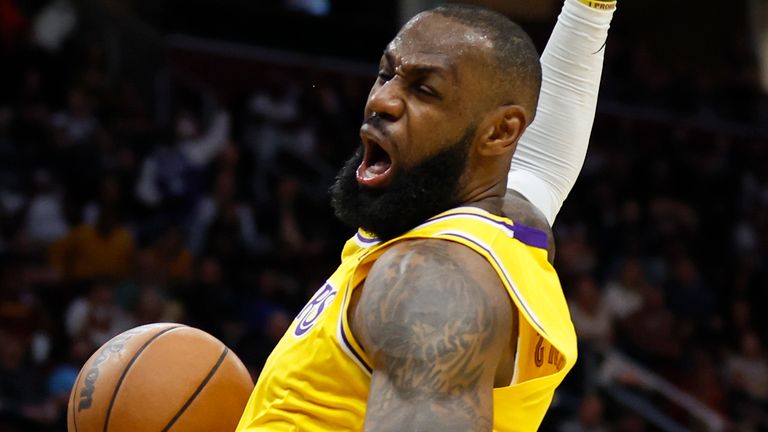 Los Angeles Lakers&#39; LeBron James dunks against the Cleveland Cavaliers during the second half of an NBA basketball game, Monday, March 21, 2022, in Cleveland. (AP Photo/Ron Schwane)