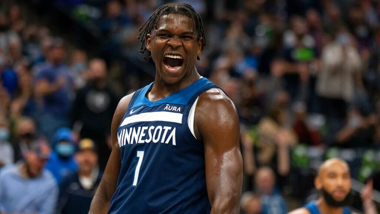 Minnesota Timberwolves guard Anthony Edwards (1) celebrates after a dunk against the Houston Rockets during the second quarter of an NBA basketball game Wednesday, Oct. 20, 2021, in Minneapolis. (Jeff Wheeler/Star Tribune via AP)