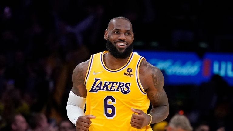 Los Angeles Lakers forward LeBron James reacts after shooting a 3-pointer during the second half of an NBA basketball game against the Golden State Warriors in Los Angeles, Saturday, March 5, 2022