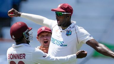 Jason Holder celebrates after pulling off a stunning catch at leg slip to dismiss Chris Woakes on the fourth morning